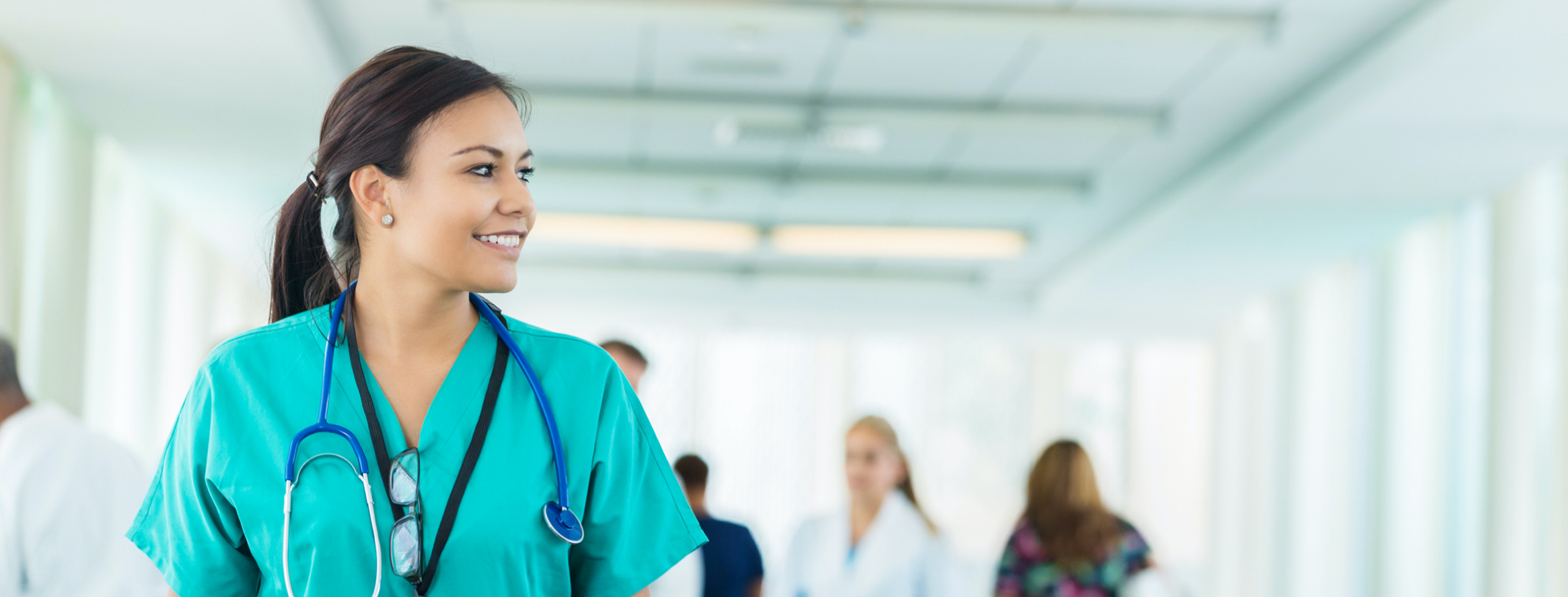 A nurse walking down a hallway