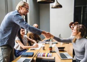 Adults Shaking Hands for Adult Enrollment