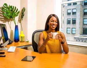 Woman at Desk with Coffee Mug