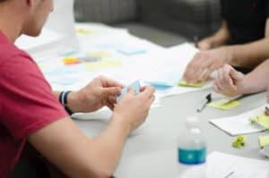 Employees Collaborating at Desk